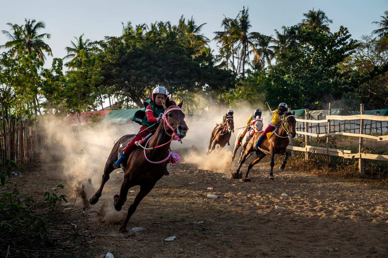 A horse race in Bima, on the Indonesian island of Sumbawa, where child jockeys are a longstanding tradition. (Adam Dean/The New York Times)