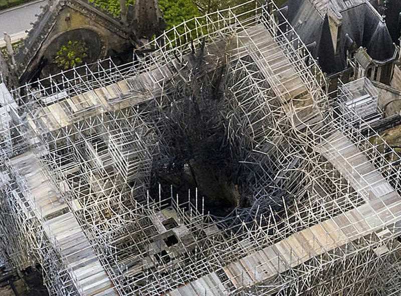 The fire damage to the area where the spire once was.
