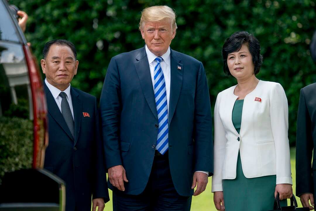 Top North Korean official Kim Yong-chol (left), President Donald Trump, and another North Korean advisor Kim Song-hye pose at the White House.