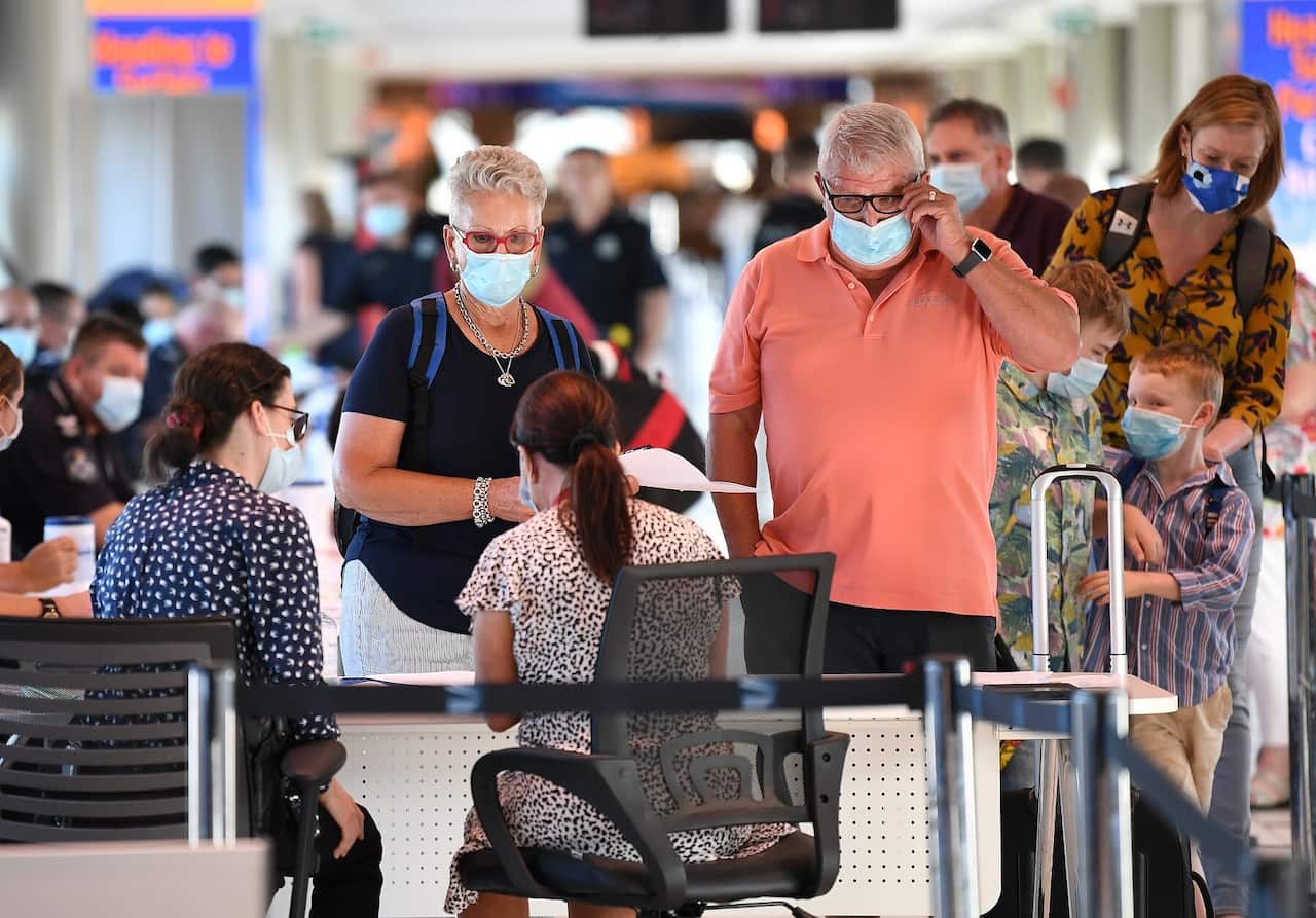Incoming passengers are screened by police at Brisbane Airport 