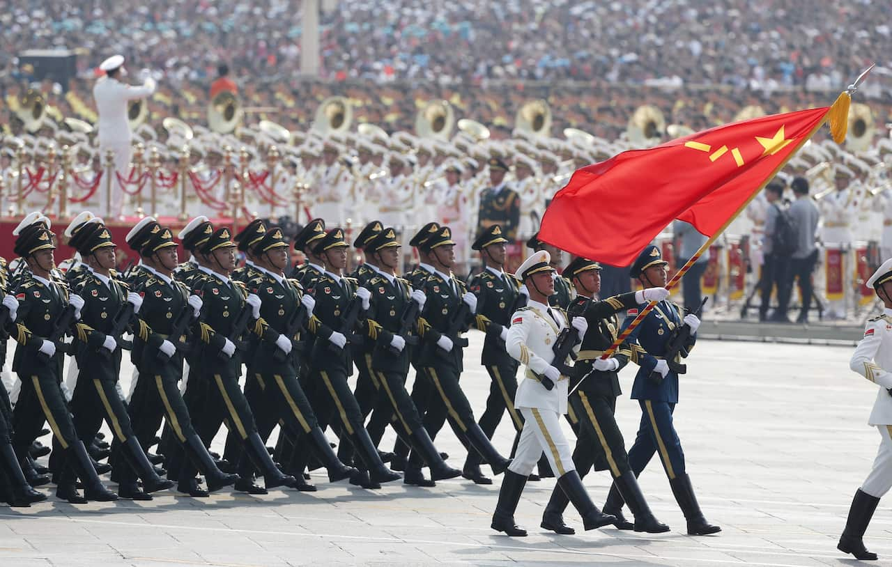 Chinese troops march past Tiananmen Square during a military parade marking the 70th anniversary of the founding of the People's Republic of China in Beijing.