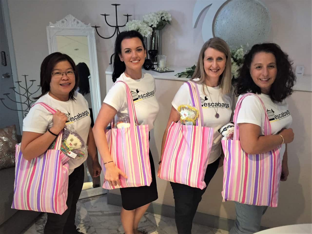 Stacy (second from left) with volunteers Sue-Lei Hunt-Mingay (left) Marie Copp and Antonia Puntillo (right).