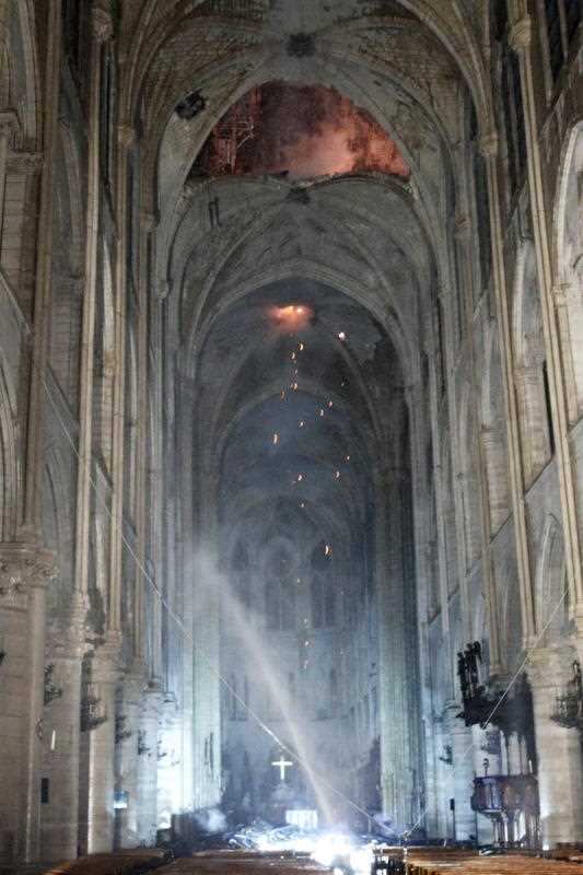 The interior of the cathedral as emergency services continue to work. The two towers and facade have been saved.