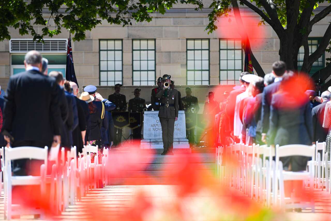 A bugler plays the last post during the 2020 Remembrance Day ceremony at the Australian War Memorial in Canberra.