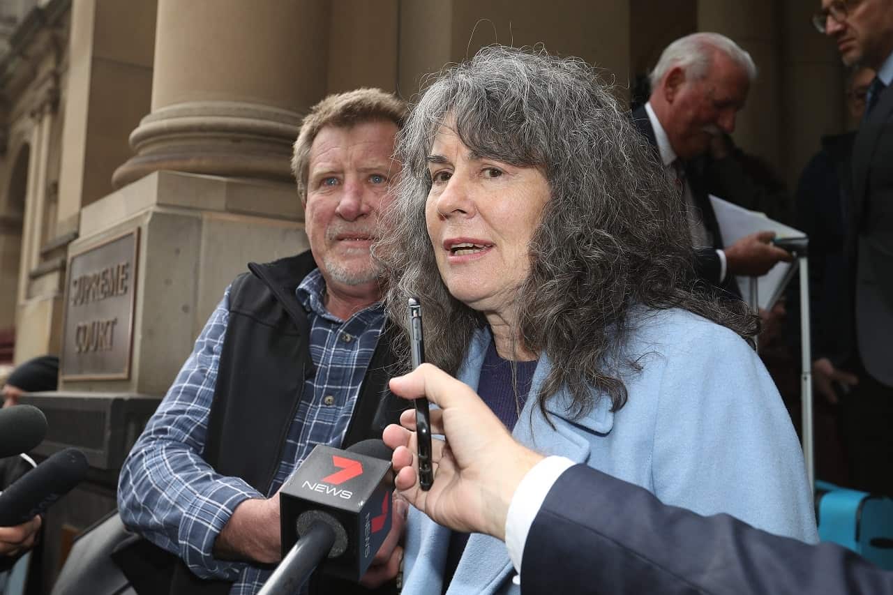 Rob Foster and Chrissie Foster talk to reporters.