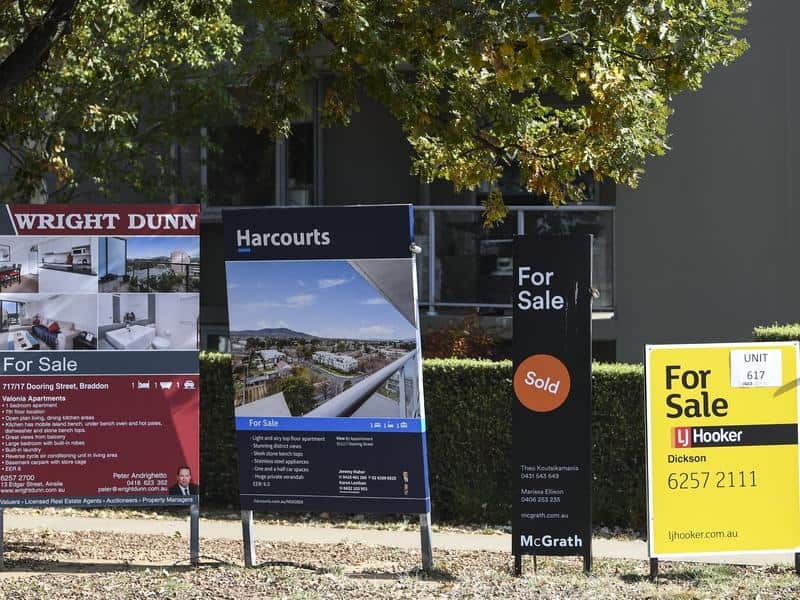 For sale signs outside an apartment block in Canberra