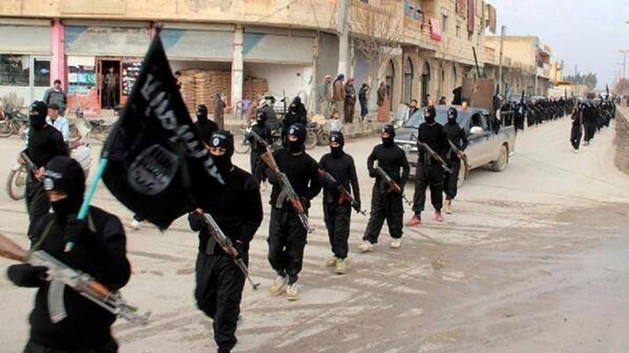 File image of fighters from the Islamic State group marching in Syria.