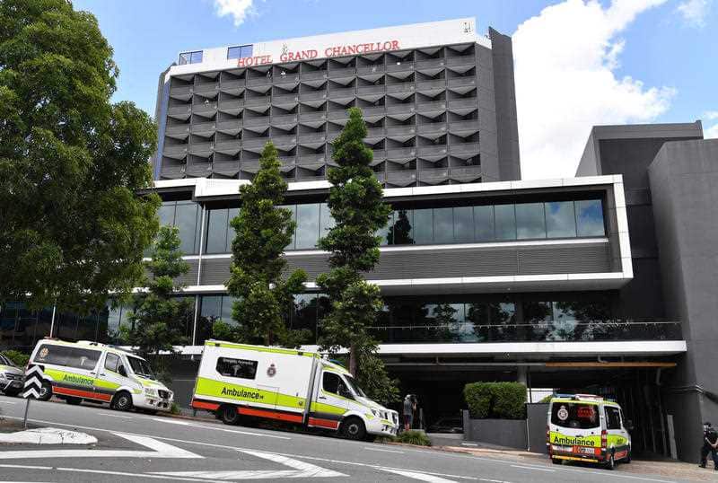 Ambulances are seen lined up outside the Hotel Grand Chancellor in Brisbane 13 January, 2021. 