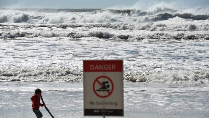 A sign informing the beach is closed at Burleigh Heads on the Gold Coast, Sunday, June 5, 2016. 