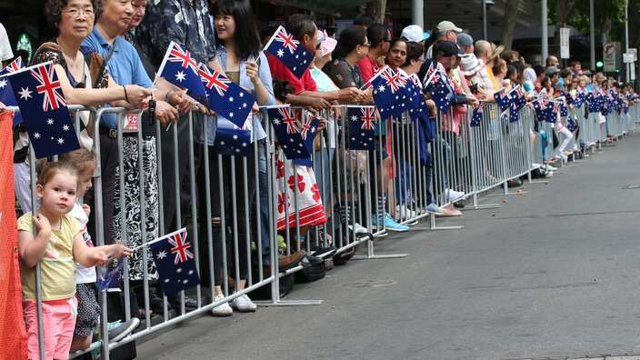 Crowds gather for the Australia Day parade down Swanston Street in Melbourne, Friday, January 26, 2018. (AAP Image/David Crosling) NO ARCHIVING