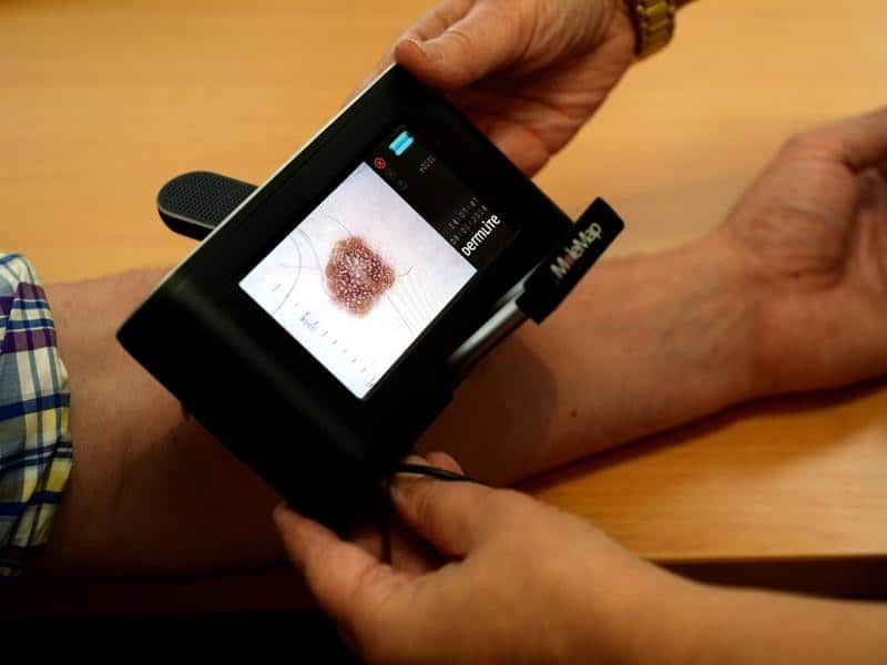 A patient being checked for skin cancers