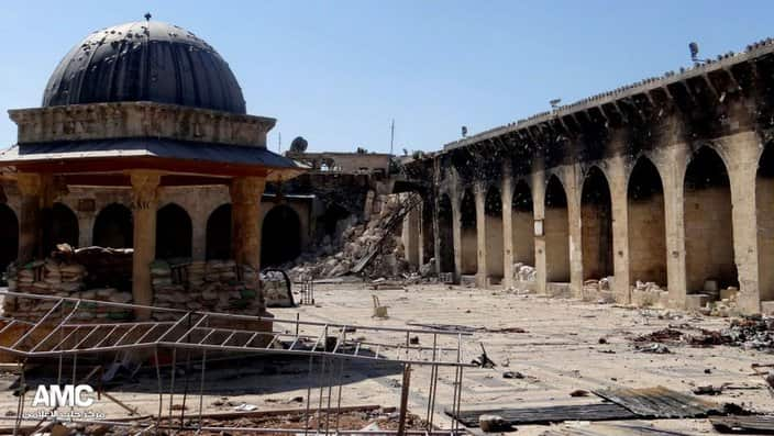 the 12th century Umayyad mosque and the remains of its minaret in the background right corner, after it was destroyed by shelling