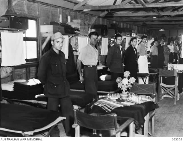 Italian POWs awaiting the commanding officer's inspection at the 16th garrison battalion POW detention camp.