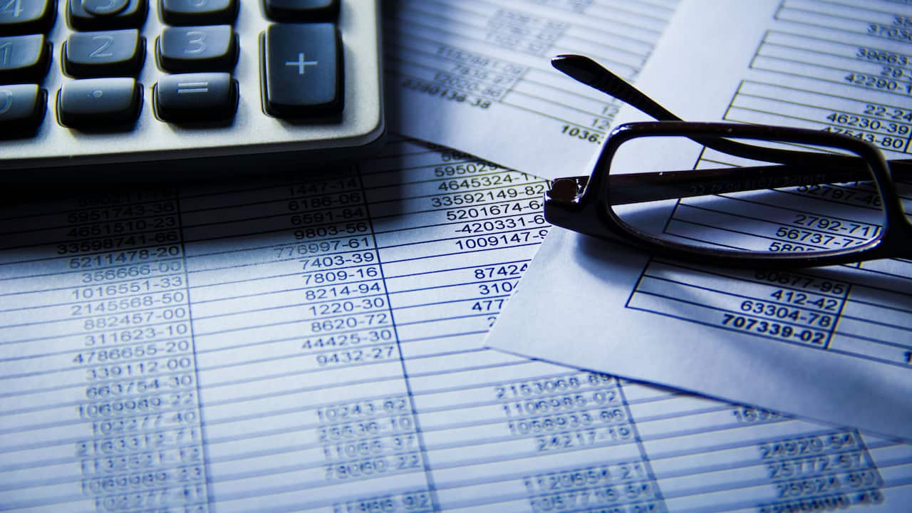 Tax document with glasses