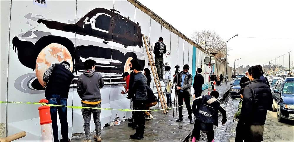 ArtLords painting a mural in Kabul