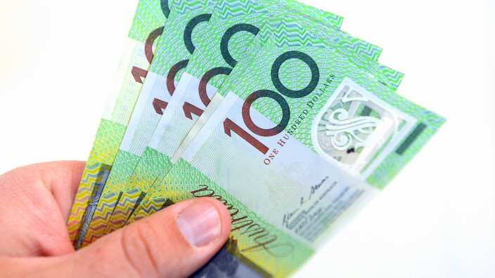 $100 Australian dollar notes, pictured in Brisbane, Tuesday, Aug. 20, 2013. (AAP Image/Dan Peled) NO ARCHIVING