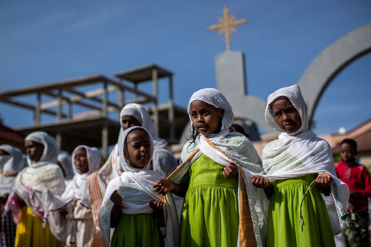 Children and other congregants pray during a Sunday morning service of the Ethiopian Orthodox Tewahedo Church in Mekele, in the Tigray region.