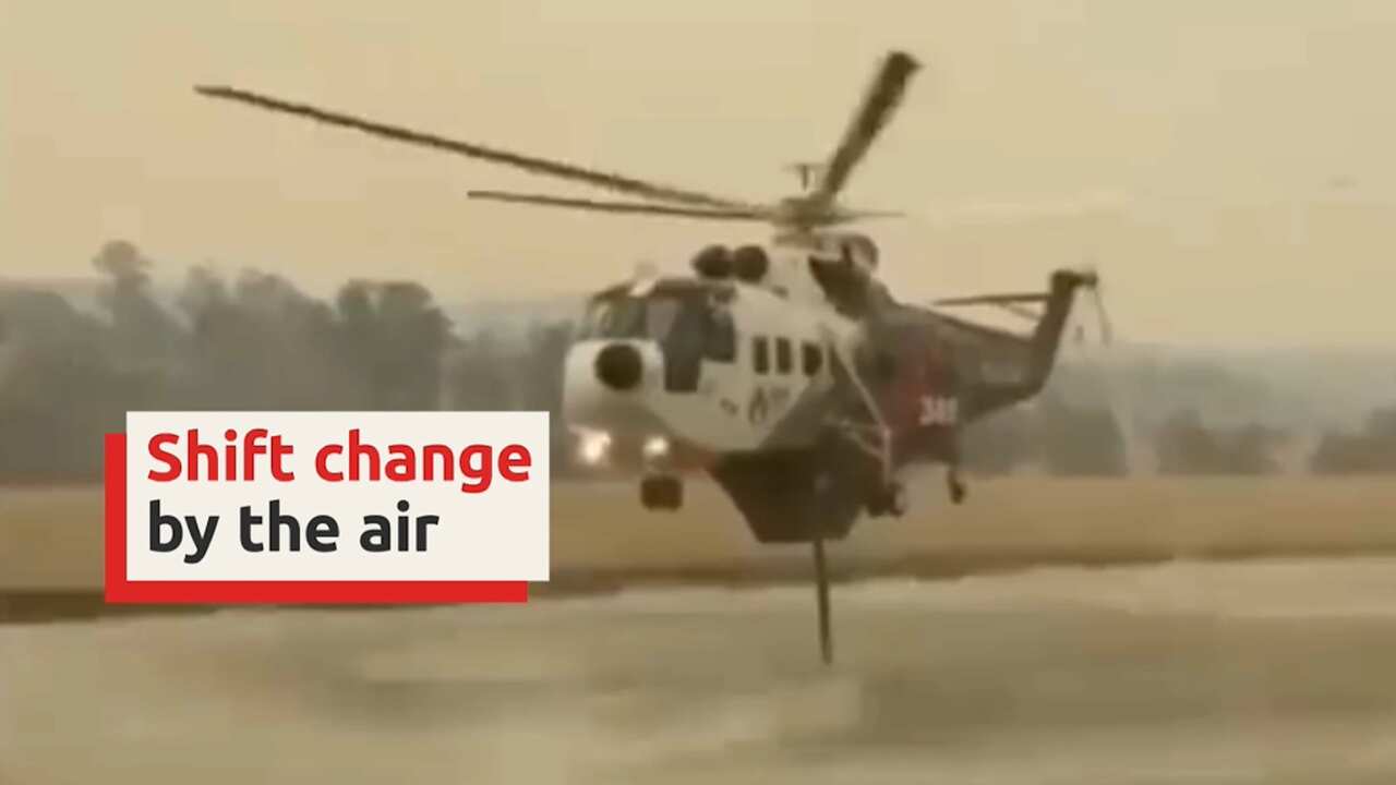 Helicopters are being used to transport firefighters into the isolated coastal town of Mallacoota in Victoria.