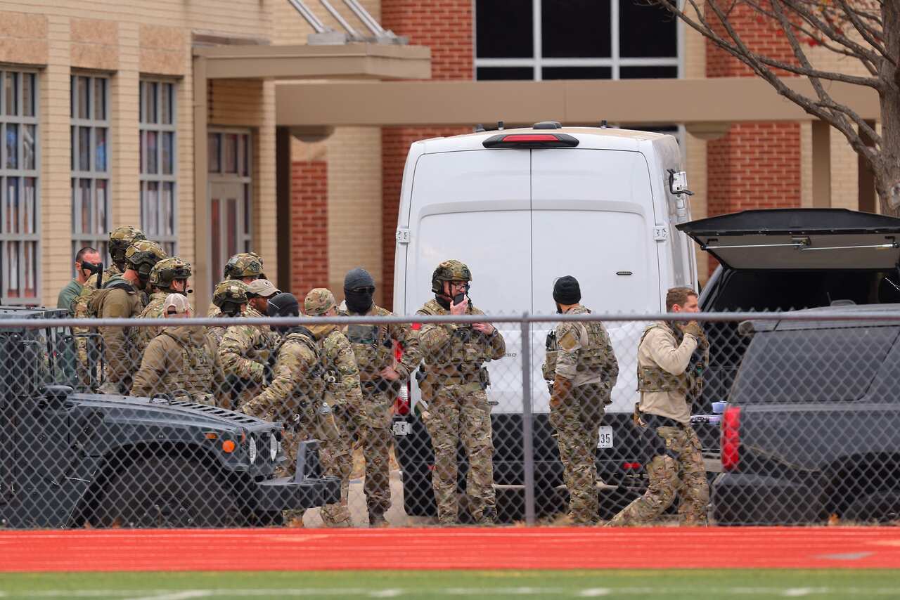 SWAT team members deploy near the Congregation Beth Israel Synagogue in Colleyville, Texas, some 40 kilometres west of Dallas, on 15 January, 2022.