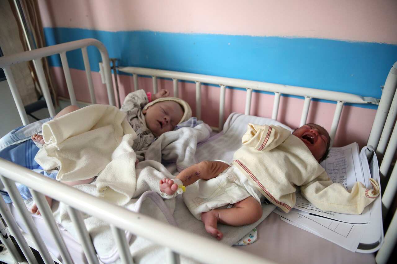 Newborn babies lie in their beds after they were rescued from a deadly attack on another maternity hospital, in Kabul, Afghanistan.