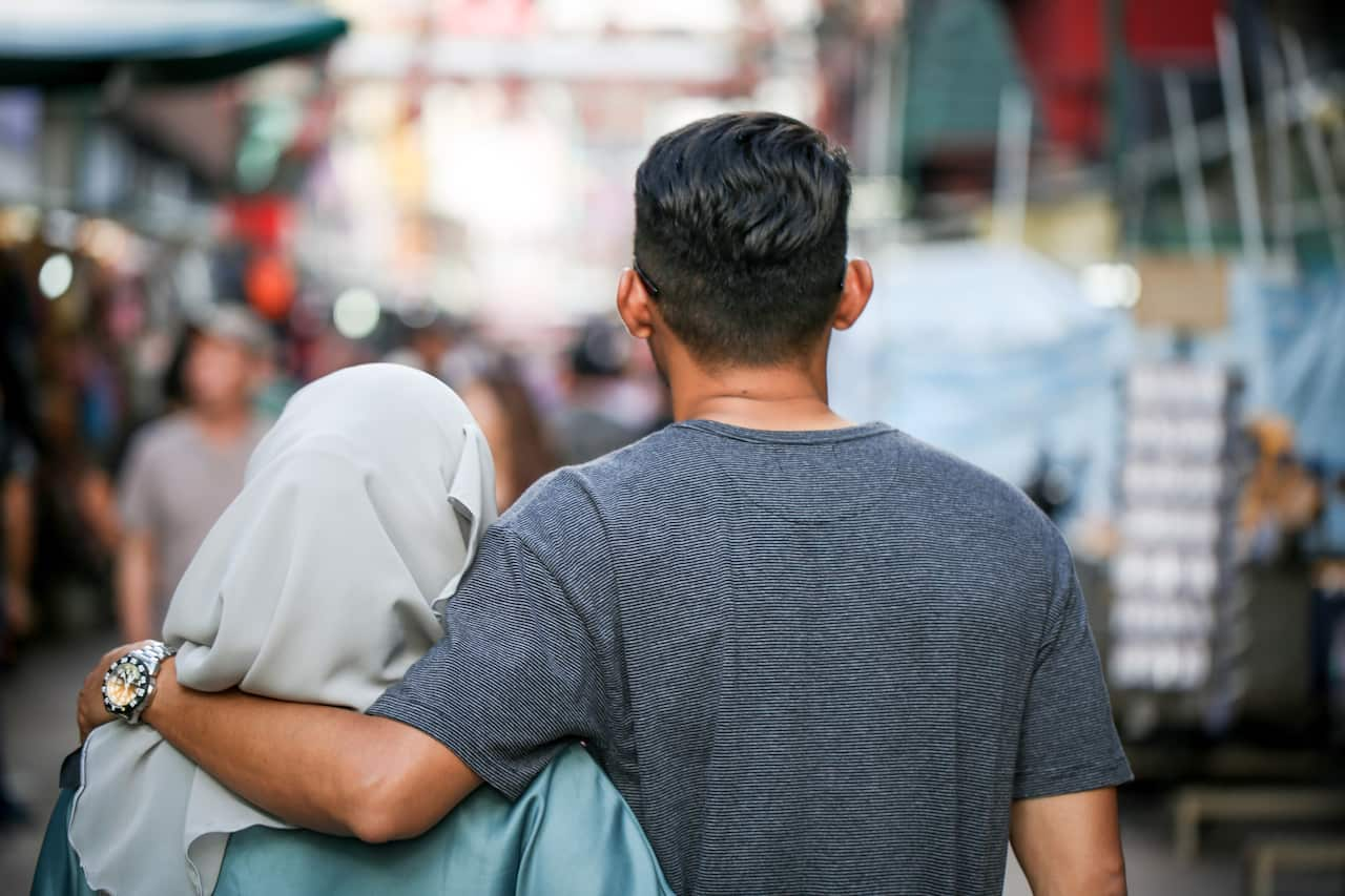 Couple walking together and embrace