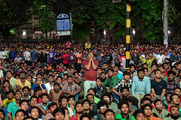 Bangladeshi cricket fans cheers as they watch the World T20 cricket tournament match between Bangladesh and India