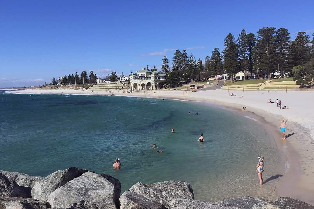 Beachgoers enjoy the Indian Ocean at Cottesloe Beach in Perth.