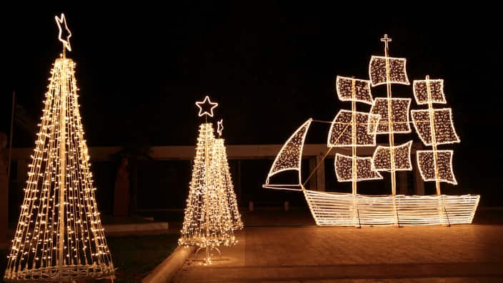 Christmas ship and trees at night
