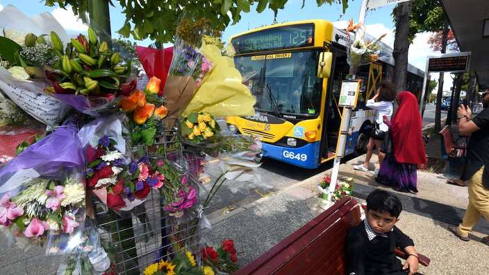 A  floral tribute is seen at a bus stop in Morooka, Brisbane, Sunday, Oct. 30, 2016. Bus driver Manmeet Sharma, also known Manmeet Alisher, died after he was set alight by 48-year-old 