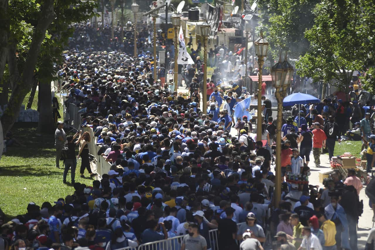 People gathered in front of the Casa Rosada building to attend the funeral ceremony of Diego Armando Maradona in Buenos Aires, Argentina.