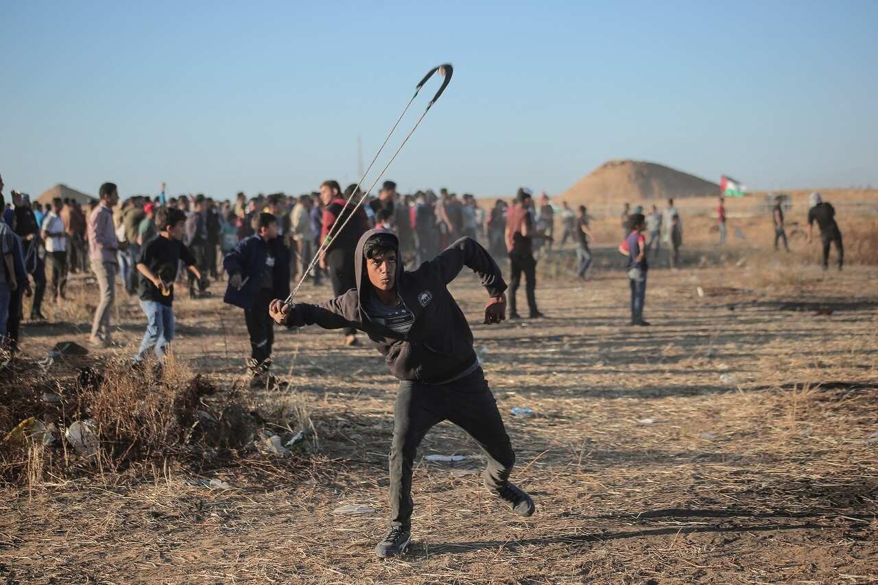 Palestinian protesters clash with Israeli troops in May.