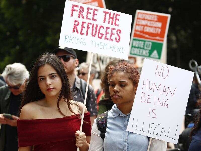 A file image of people attending a rally in support of refugees