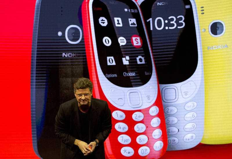 Arto Nummela, Chief Executive Officer at HMD Global, shows the new re-launched Nokia 3310 phone, ahead of Monday's opening of the Mobile World Congress wireless show in Barcelona, Spain, Sunday, Feb. 26, 2017. Finland-based HMD Global is re-launching the 