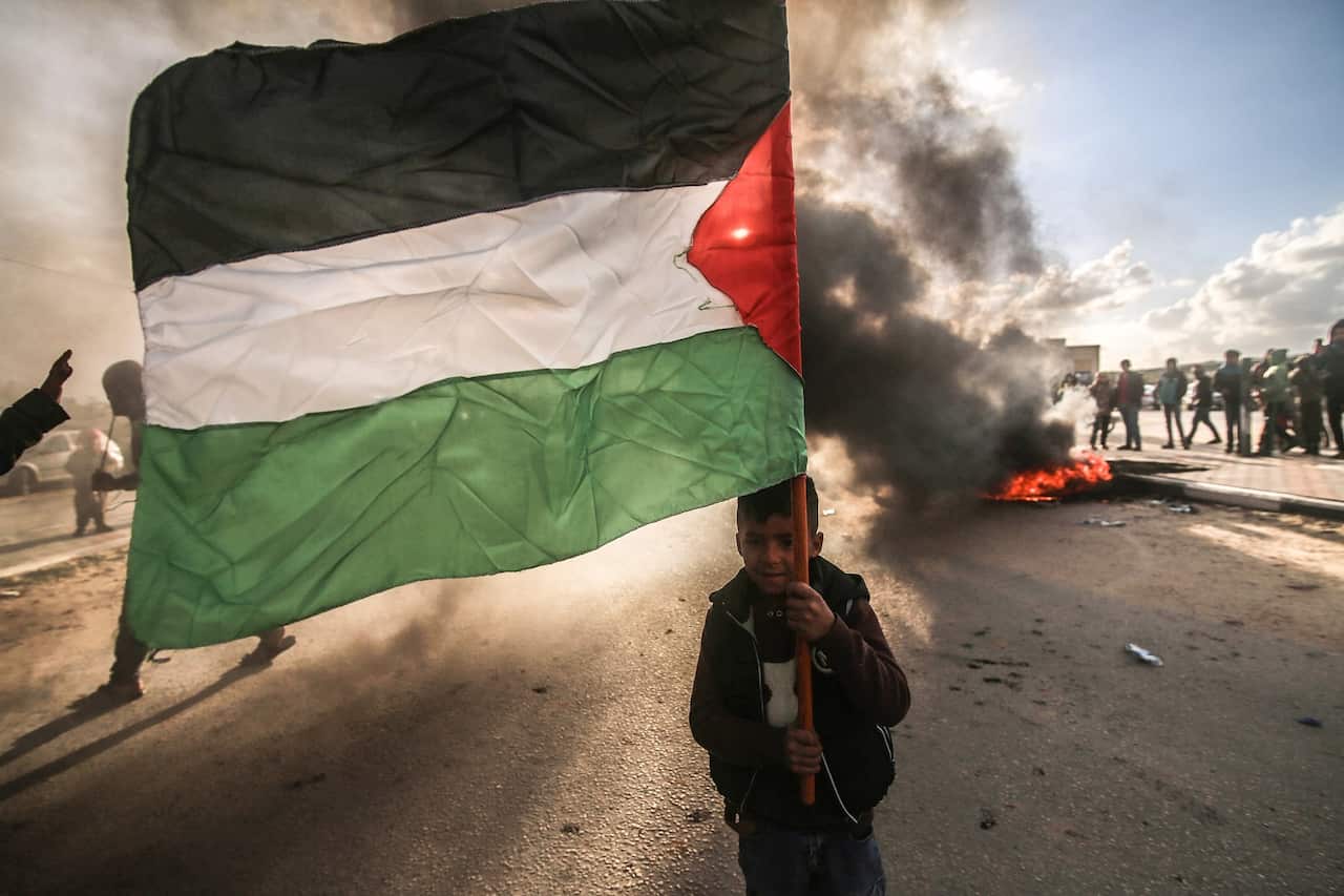 Palestinians seen protesting in Rafah, in the southern Gaza Strip against Israel's razing of the land.