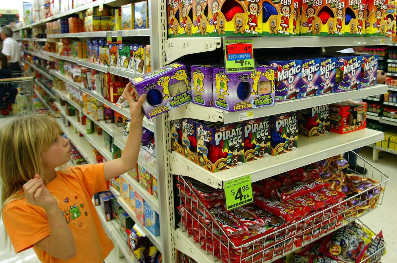 A young shopper picks out an Easter Egg from the d