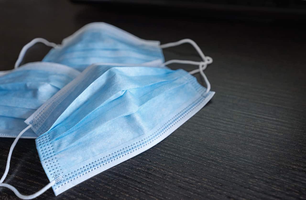 Respiratory mask on desk in office, Protective medical mask with 2019-nCoV, Coronavirus protection concept.