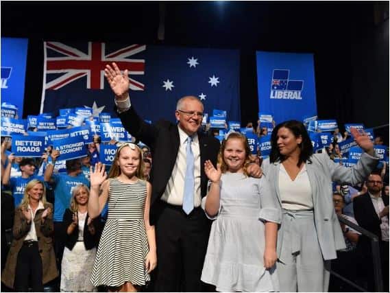 Prime Minister Scott Morrison with daughters Abbey, Lily and wife Jenny at Sunday's campaign rally.