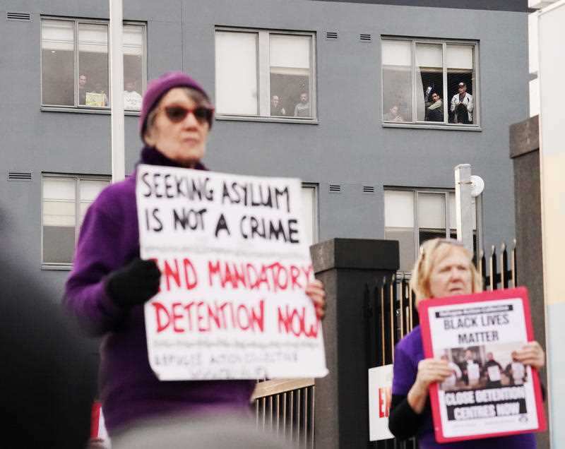 Refugees and protesters participate in a "Free The Refugees" rally at the Mantra Hotel in Melbourne, Saturday, June 13, 2020.