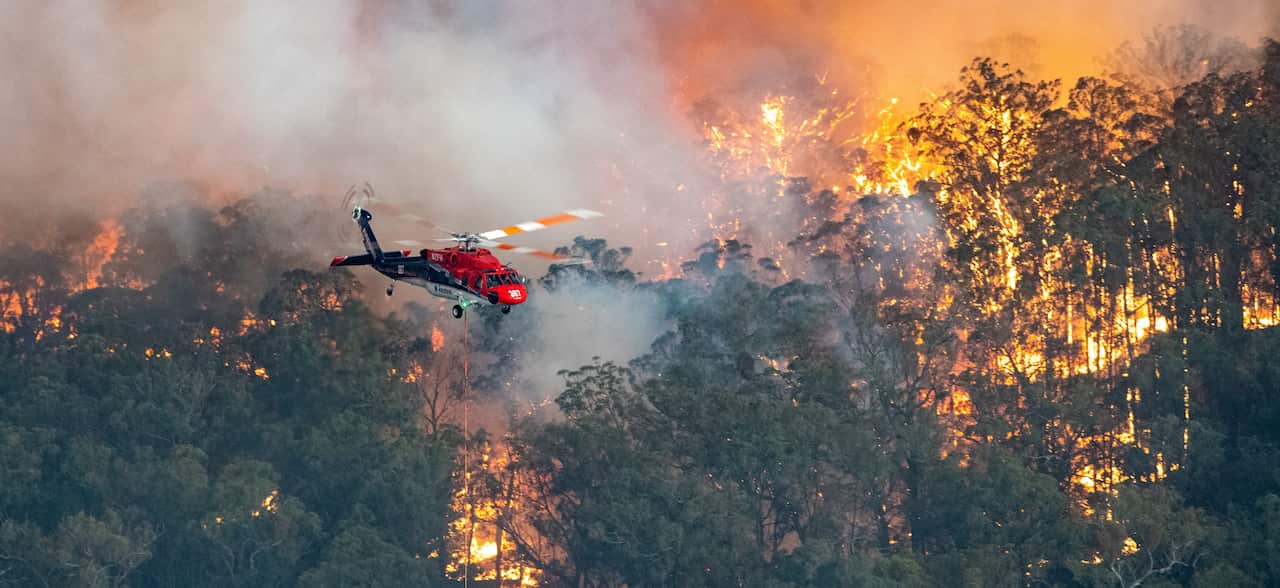 A firefighting helicopter battles a bushfire near Bairnsdale in Victoria's East Gippsland region. STATE GOVERNMENT OF VICTORIA