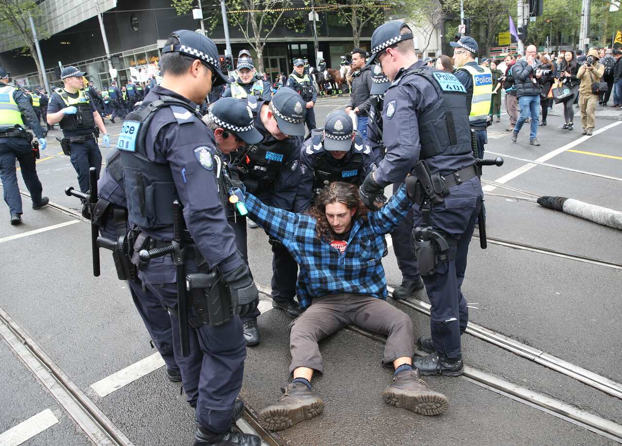 Activists from Extinction Rebellion participate in a protest in Melbourne on the intersection of Spencer and Collins street.