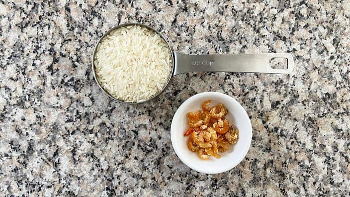 All you really need is rice and water, but you can add stock or seasonings like dried shrimp.