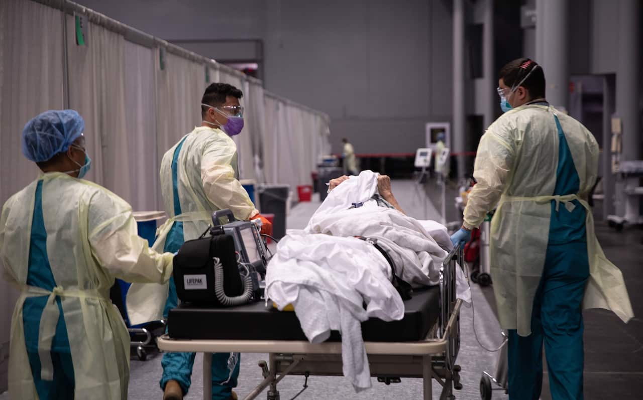 US Army service members from the 531st field hospital, deployed from Fort Campbell, Kentucky transporting a patient to the Intensive Care Unit. 