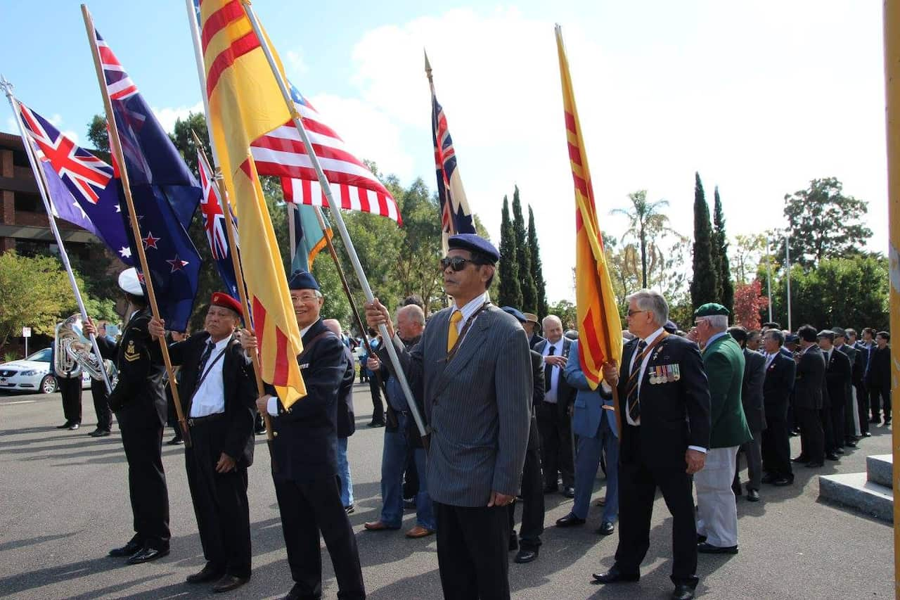 Former Vietnamese flags and Australian flags at ANZAC Day celebrations at Footscray RSL, 2016