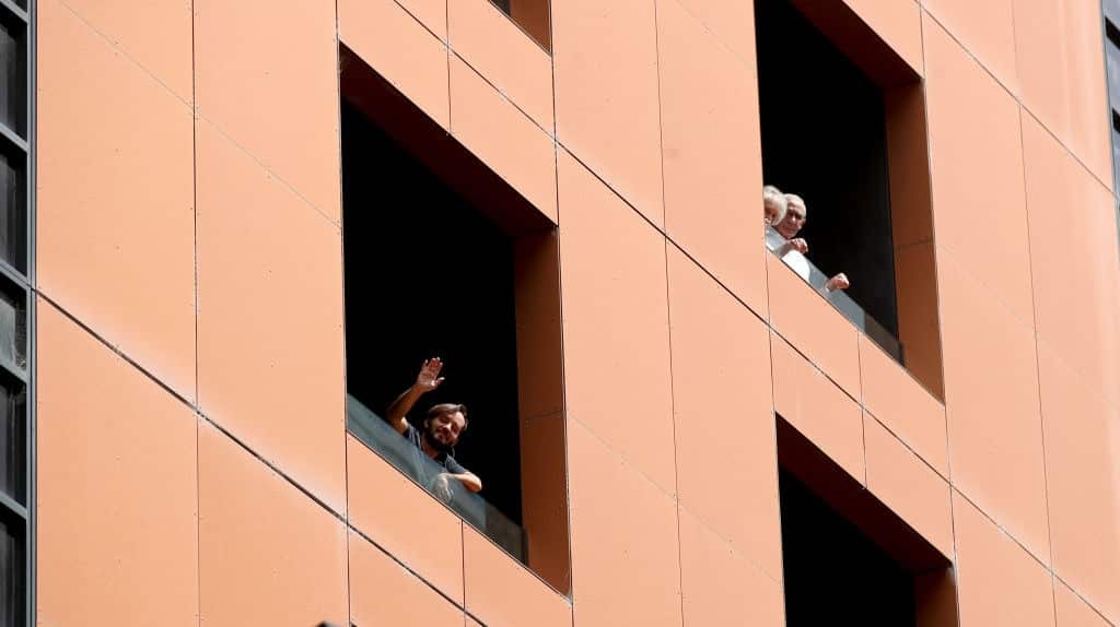 Quarantined hotel quests on the balcony of the Peppers on Waymouth Hotel on 18 November, 2020 in Adelaide, Australia.