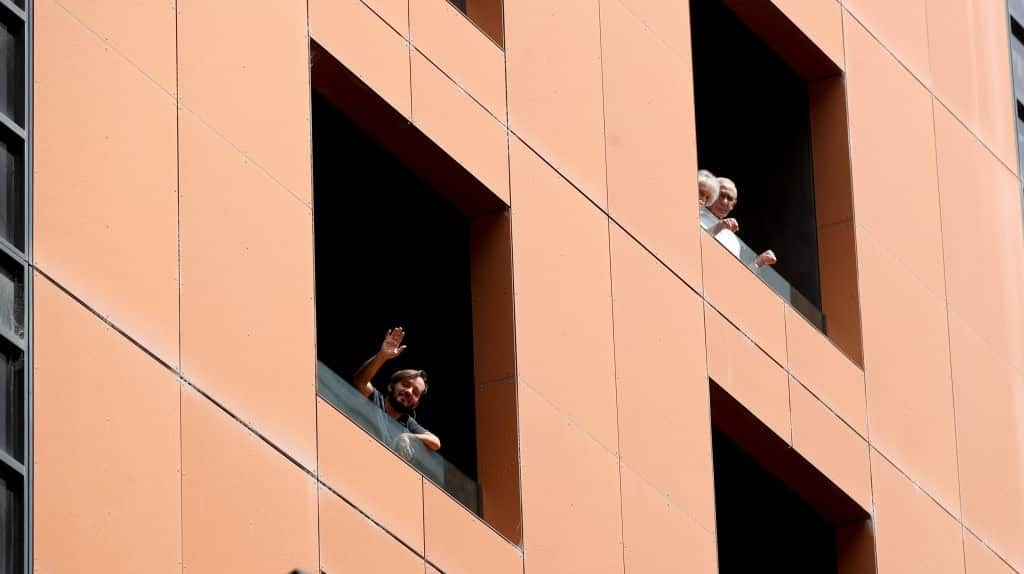 Quarantined hotel quests on the balcony of the Peppers on Waymouth Hotel on 18 November, 2020 in Adelaide, Australia. 