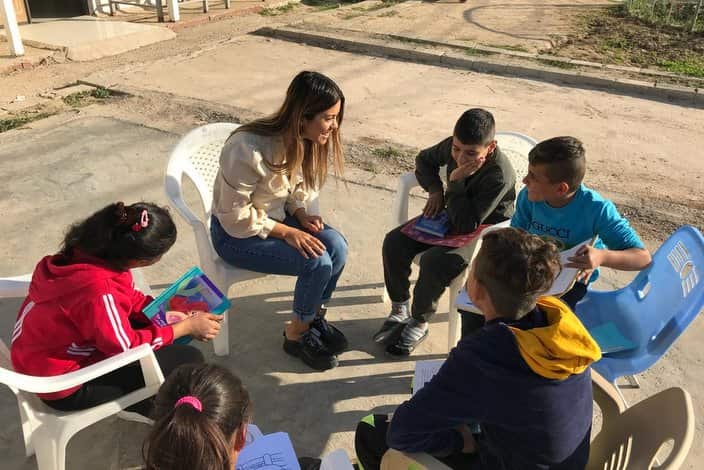 Dashni Morad with children from Green Kids
