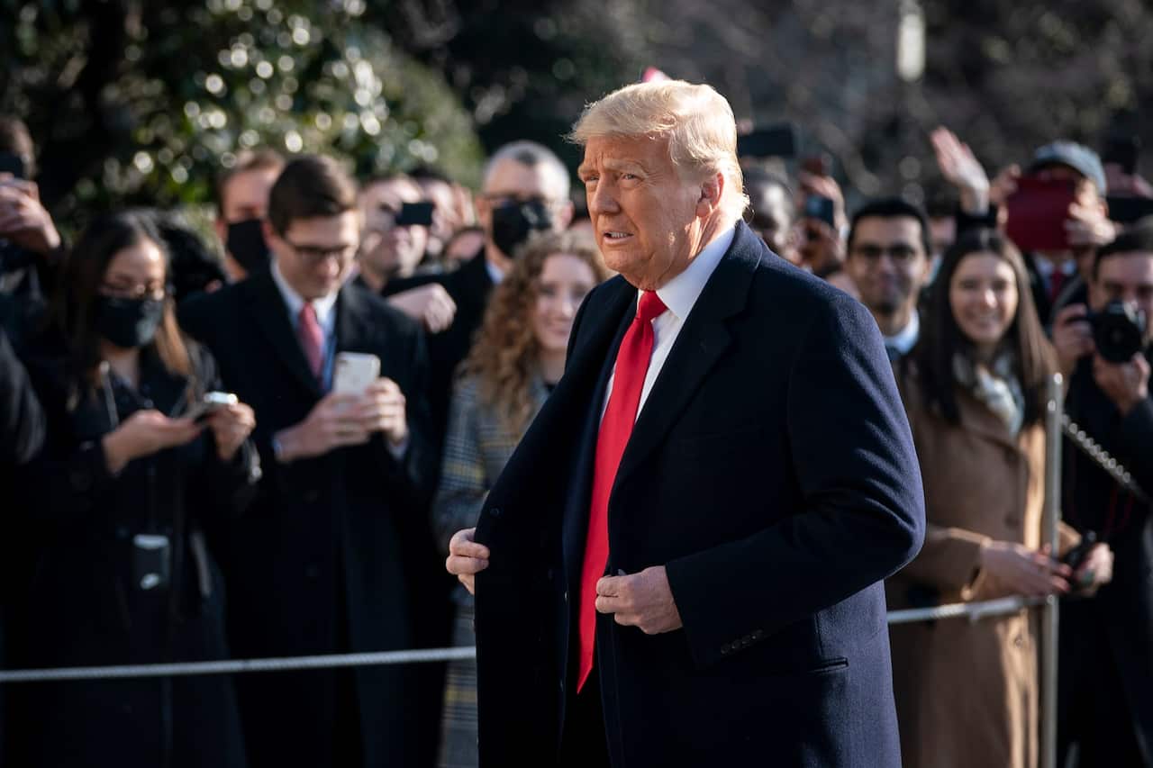 President Donald Trump exits the White House to walk toward Marine One on the South Lawn on 12 January, 2021 in Washington, DC.