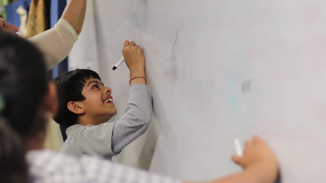 Student writing Hindi at Darcy Road Public School Wentworthville