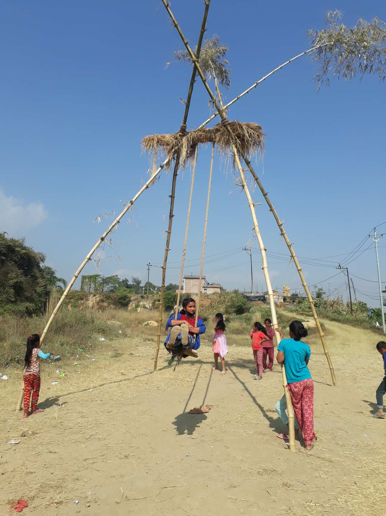 Children on swing in Nepal during Dashain festival.