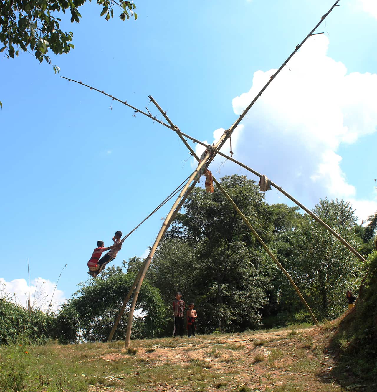 Children on swing during Dashain in Nepal.